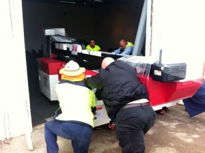 Pushed through a specially cut hole in the wall